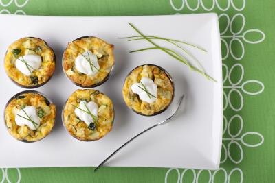 Mini quiche appetizers with sour cream and chives
