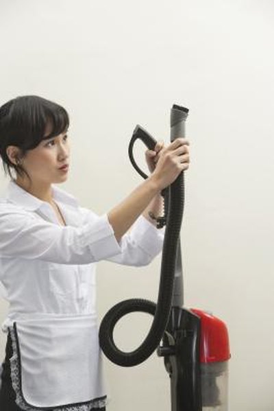 use a vacuum to remove dust from interior brick walls