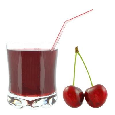 Cherry juice with fresh cherries on the side.