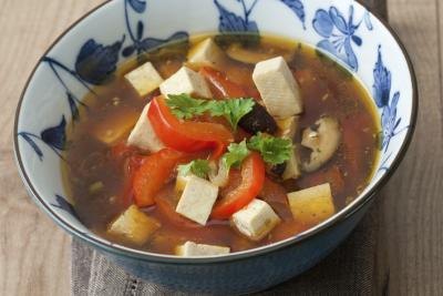 An asian style soup with tofu.