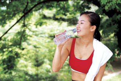 Woman drinking bottle of water