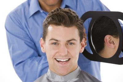 Man smiling after haircut.