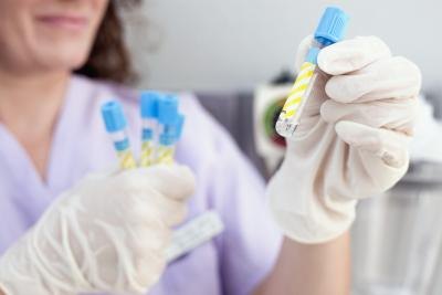 woman holding blood samples