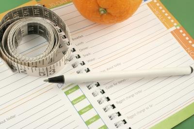 Track your food intake and weight loss in a journal.
