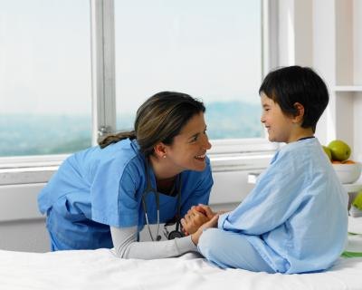 Young boy in hospital with doctor.