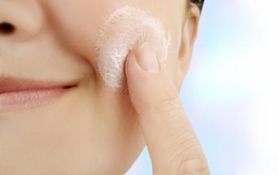 Rub the toothpaste into the blemish.