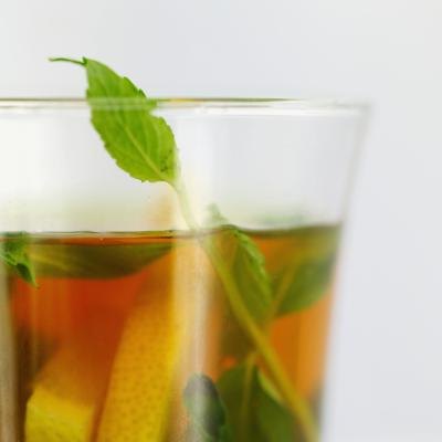 Close up of herbal tea with fresh herbs.