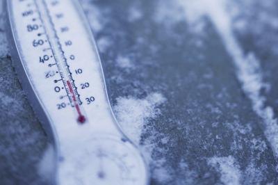 Thermometer in cold outdoors weather.