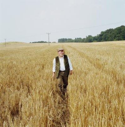 Farmer walking through field