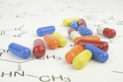 Close up of pills on a scientific chart.