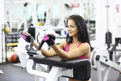 Woman uses exercise machine