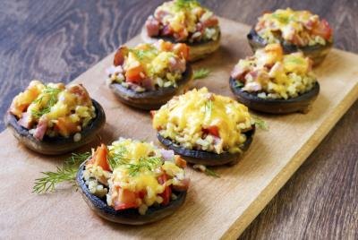 Stuffed mushrooms on a wooden tray