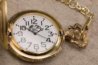 Gold pocket watch.