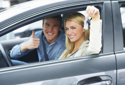 Young people in a new car.