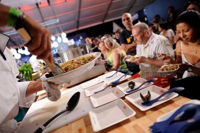 Pasta being served to guests