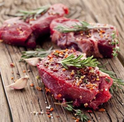 Raw steak with seasoning