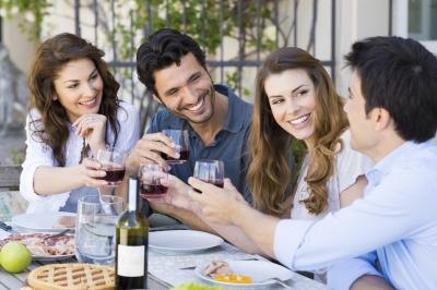 friends drinking wine and smiling