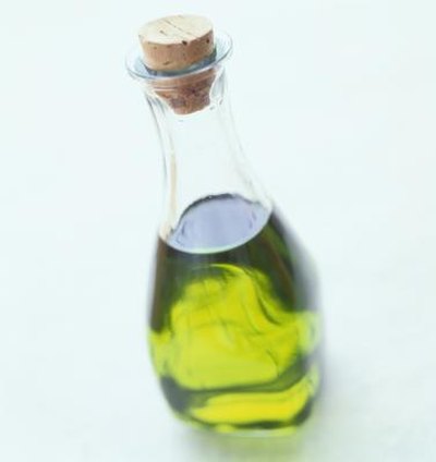 Olive oil in clear jar.