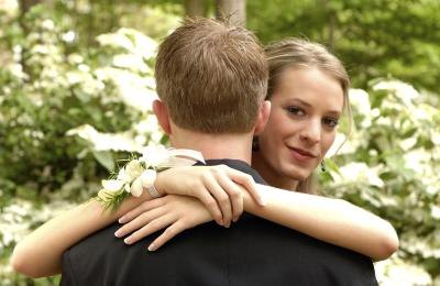 Girl hugs prom date