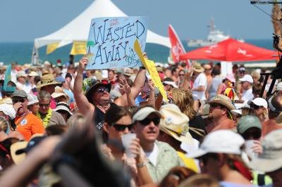 View of crowd at Jimmy Buffett concert at the beach