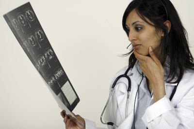 Doctor examining x-rays.