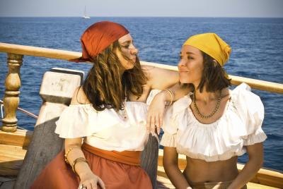Two women dressed as pirates on boat