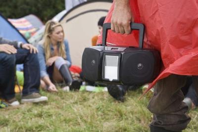 Listening to music through speakers will not cause as much direct damage to your eardrums.