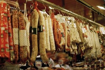 Pepperoni and hard salami's hanging at deli counter
