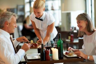 Waitress attending to customers