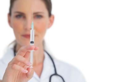 Nurse with syringe for injection.