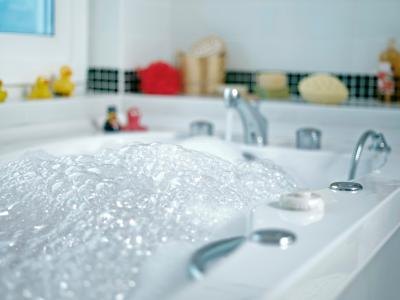 Close up of a bath filled with water.