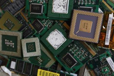 Computer processors and circuit boards on scrap pile