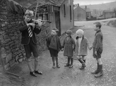 Local farming boys listening to music, 1935