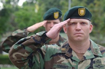 U.S. Special Forces officers salute during the American anthem.