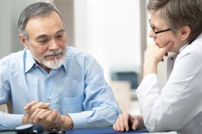 A man talks with his doctor about low estrogen levels.