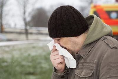 Man blowing nose