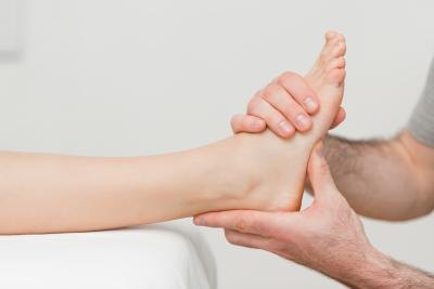 Doctor looking at patients foot