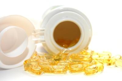 Vitamin D spilling out of bottle.