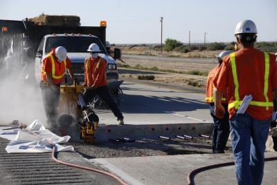 Construction workers follow strictly laid out plans.