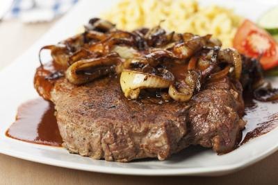 cooked red meat on a plate