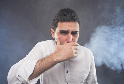 Coughing young man.