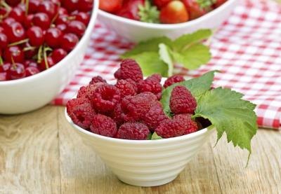 Raspberries are low in potassium but eating large amounts of even low potassium foods will cause blood levels to spike.