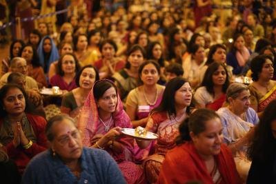 Wellwishers with candles prepare to celebrate Diwali