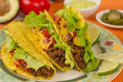 Plate of tacos with lime wedges