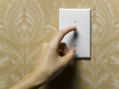 Woman turning off lights