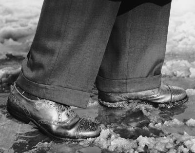 Close up on man's shoes in the 1950's