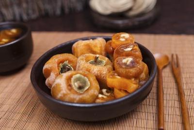 Persimmons in skillet.