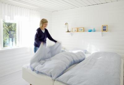 Woman looking at bedding