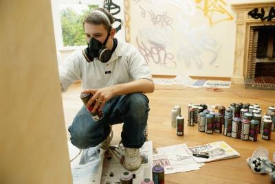 man using spray paint
