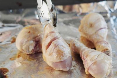 Dip the drumsticks in the beaten egg.